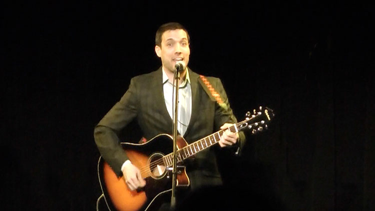 Rob on stage with guitar