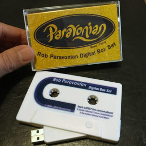Groovy product shot with cassette-shaped USB drive and case